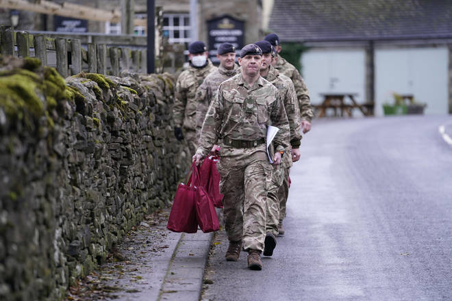 Members of the armed forces in Weardale today carrying care packs containing hot water bottles, hats, blankets, gloves and thermal socks.