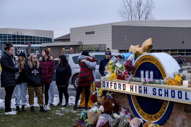 Students pay their respects at a memorial at Oxford High School a day after the year's deadliest U.S. school shooting which killed and injured several people, in Oxford, Michigan, U.S.