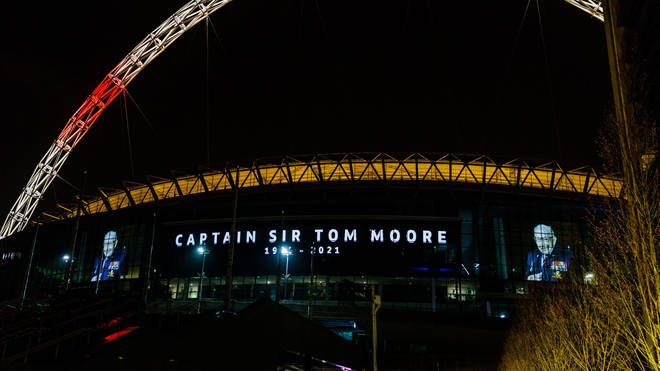 Wembley Stadium lit up in tribute to Captain Sir Tom Moore died having tested positive for Covid-19