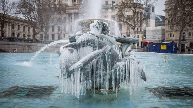 Icicles hang from the mermaid fountain statues in Trafalgar Square during storm Darcy