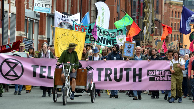 Extinction Rebellion, marched through Manchester, uk, and held a series of die-ins to urge for action on climate change