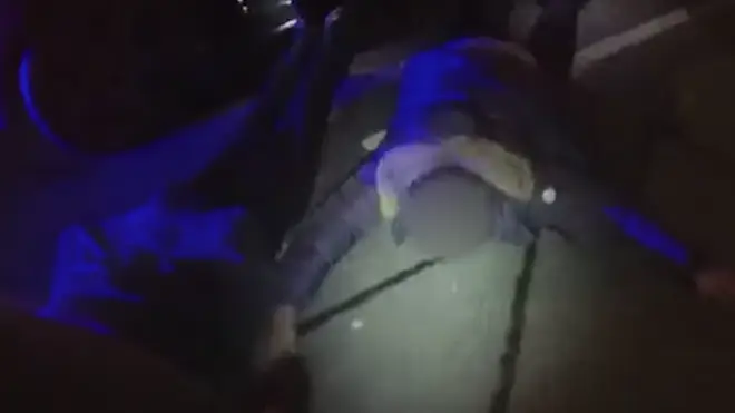 The dramatic arrest was caught on one of the police officer's body-cams