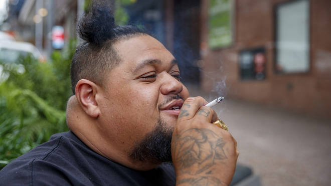 A New Zealander smoking a cigarette