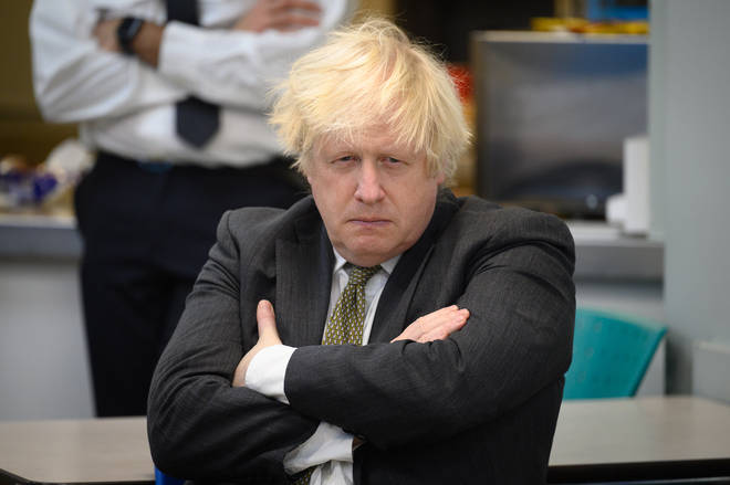 Boris Johnson, pictured on Friday, is under renewed pressure after a photo emerged of him and his wife in the Downing Street garden with up to 17 staff, allegedly during the first national lockdown.