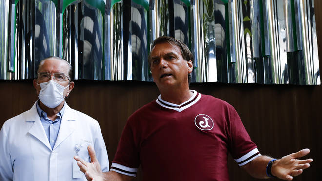Brazilian President Jair Bolsonaro, right, and his personal doctor, Antonio Luiz Macedo