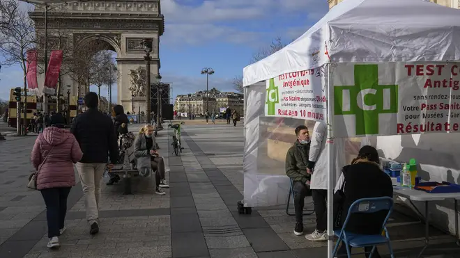 A man gets a nasal swap at a mobile Covid-19 testing site at the Champs Elysees in Paris