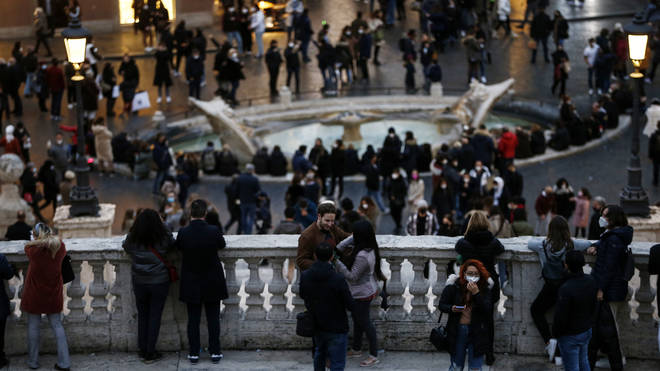 Tourists and residents enjoy the evening at Spanish Steps in Rome (Cecilia Fabiano/AP)