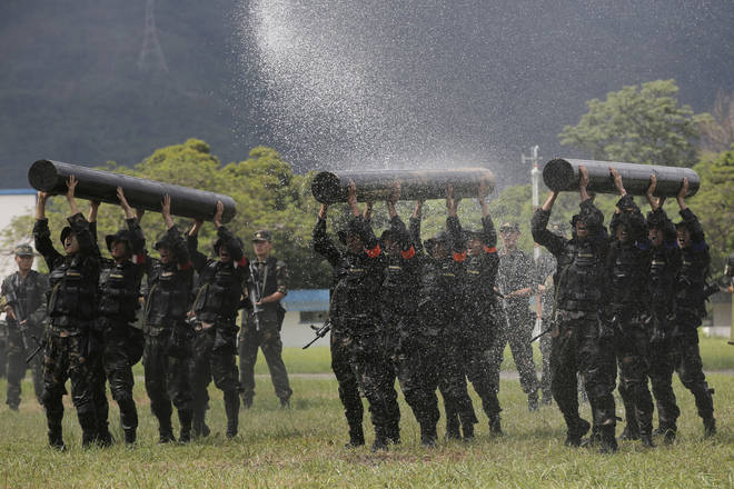 Chinese soldiers based in Hong Kong demonstrate their skill at the Shek Kong barracks (Kin Cheung/AP)