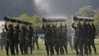 Chinese soldiers based in Hong Kong demonstrate their skill at the Shek Kong barracks (Kin Cheung/AP)