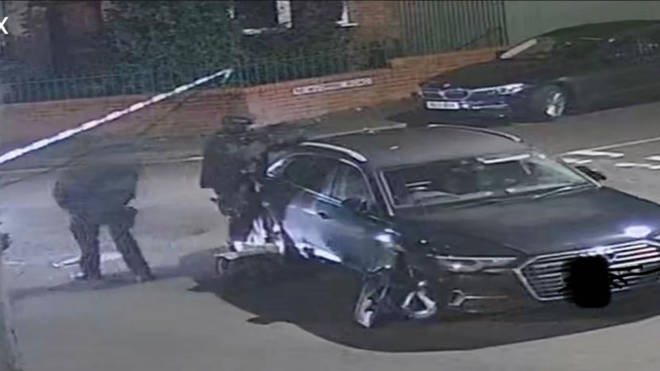 CCTV showed armed police outside the house on Monday.