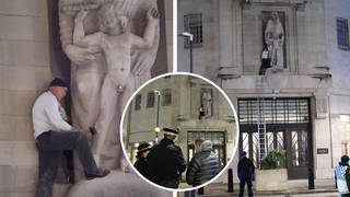 A man has been seen smashing a statue with a hammer in central London.