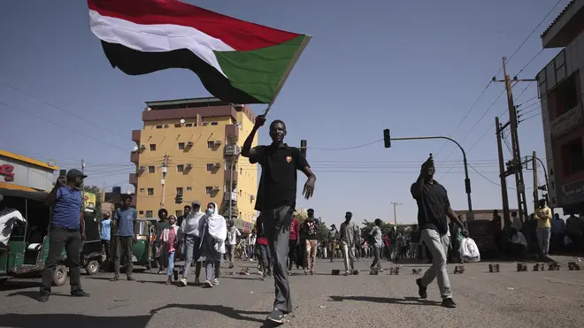 People march during a protest to denounce the October 2021 military coup, in Khartoum, Sudan