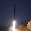FILE – This photo provided by the North Korean government shows what it says a test launch of a hypersonic missile