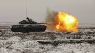 A Russian tank fires as troops take part in drills at the Kadamovskiy firing range in the Rostov region in southern Russia