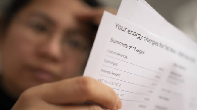 A person reading an energy bill