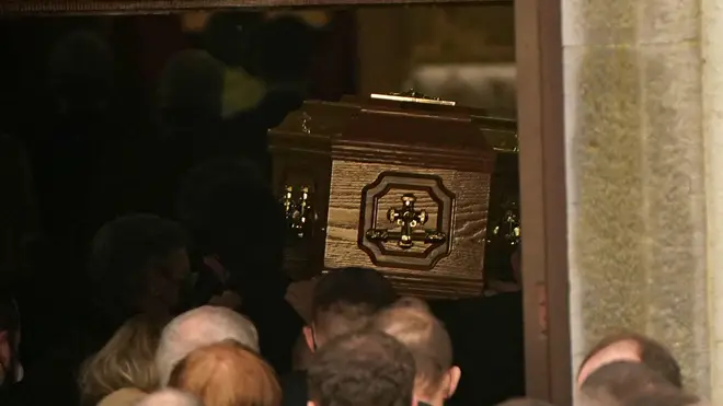 Crowds followed the coffin into the church.