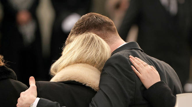 Ashling's sister and boyfriend comforted each other as they arrived at the funeral.