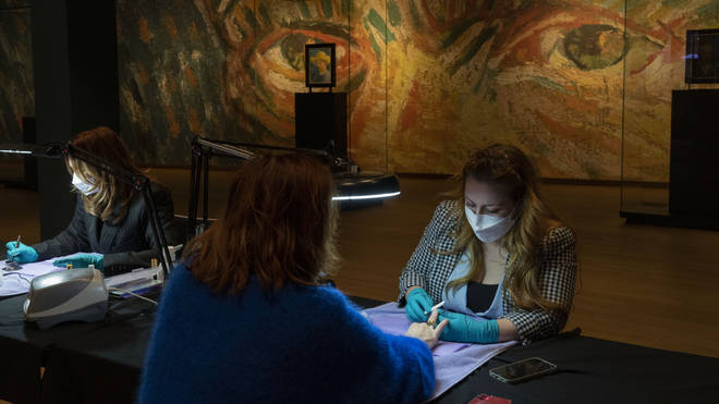 A woman gets a manicure at the Van Gogh museum (Peter Dejong/AP)
