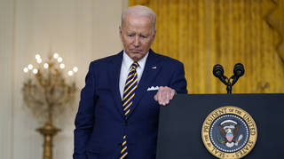 President Biden stands next to a lectern