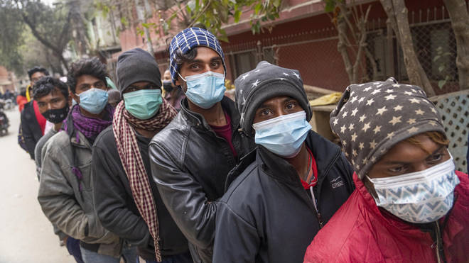 People queue to receive a Covid vaccine in Kathmandu, Nepal