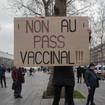 A demonstrator holds a placard that reads ‘No to vaccine pass’ during a rally in Paris, France