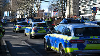 Police vehicles on the grounds of Heidelberg University in Heidelberg, Germany