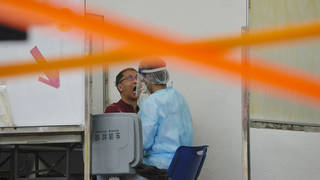 A resident gets tested for coronavirus in Hong Kong (Kin Cheung/AP)