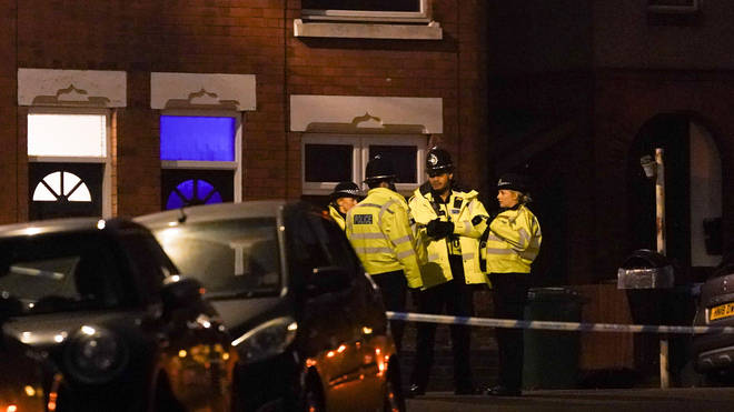 Police near an address in Coventry where a woman was arrested on suspicion of murder