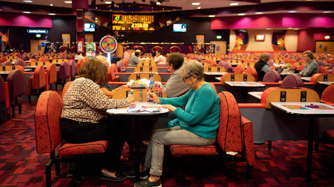 Customers enjoy a game at a Mecca Bingo hall