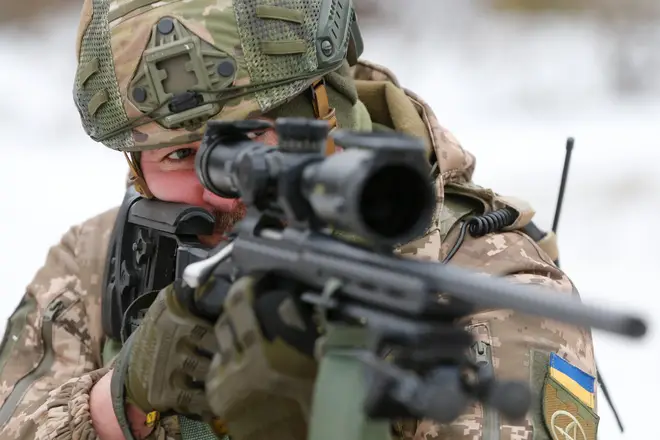 A reservist of the Ukrainian Territorial Defence Forces takes part in military exercises on the outskirts of Kyiv