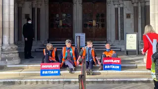 Four eco protesters glued themselves to the steps of the High Court.