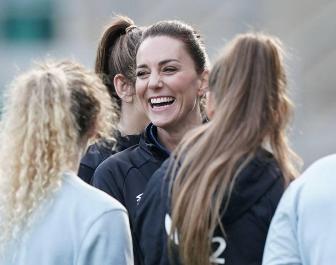 Kate wore a black England rugby top, black sports leggings and rugby boots for the session