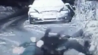 The officer laughs after falling over
