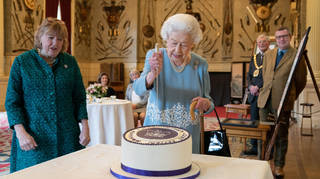 The Queen cut into a cake to kick off her celebrations