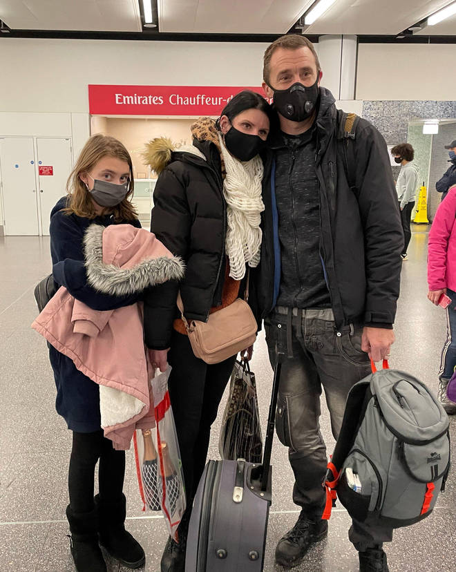 Paul Meakin, his wife Svetlana and their daughter arrive at Gatwick from Kyiv, Ukraine. Thousands of Britons are being urged to flee