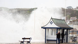 Storm Eunice and rough seas bring huge crashing waves along Aberystwyth promenade.