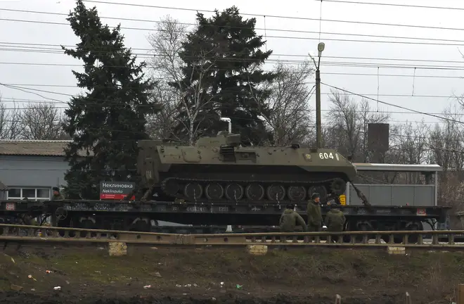 A Russian military vehicle is seen loaded on a train platform at the Neklinovka railway station in Russia's southern Rostov region, which borders the self-proclaimed Donetsk People's Republic.