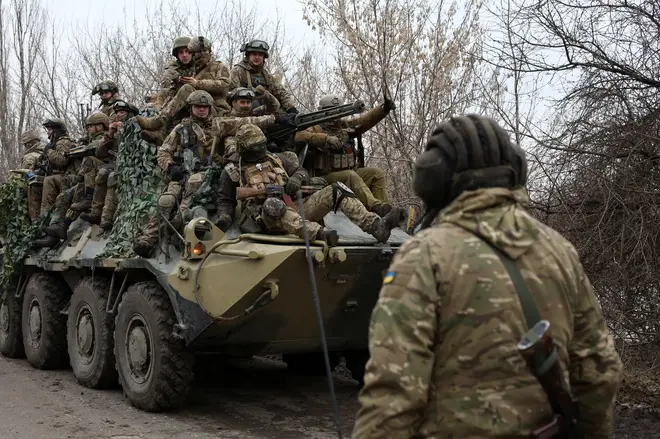 Ukrainian servicemen get ready to repel an attack in Ukraine's Lugansk region