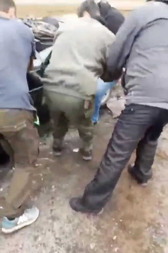 People rushed to free the elderly man from the crushed car
