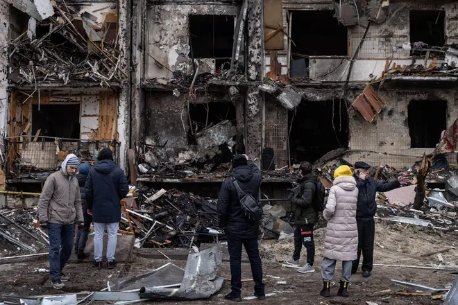 A damaged residential block hit by an early morning missile strike in Kyiv
