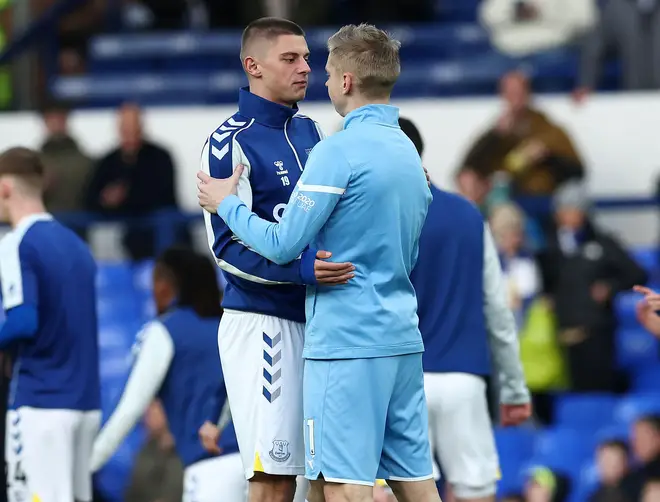 Ukrainians Vitalli Mykolenko of Everton and Oleksandr Zinchenko of Manchester City embrace before the Premier League match at Goodison Park, Liverpool.