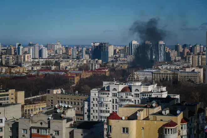 A smoke column rises after an attack in Kyiv