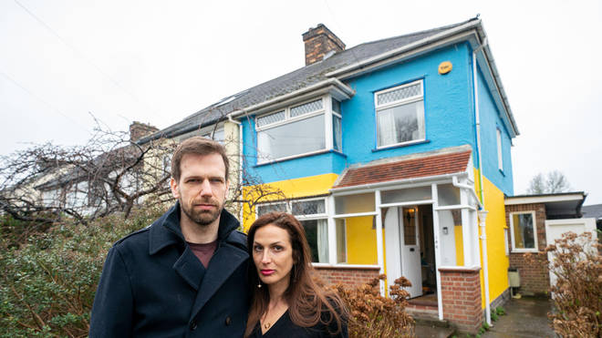 A UK couple have painted their house in the colours of the Ukraine flag