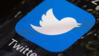 In this April 26, 2017, file photo is a Twitter app icon on a mobile phone