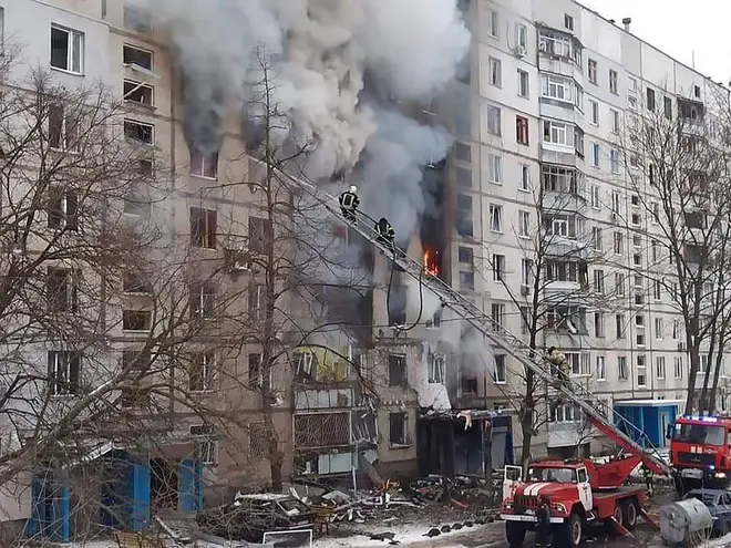 A commander said he feels "shame" about the invasion - pictured, a building on fire in Kharkiv