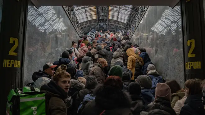 Thousands flock to Lviv station to try to get a train out of Ukraine as desperation grows at Ukraine border as more than half a million refugees flee war