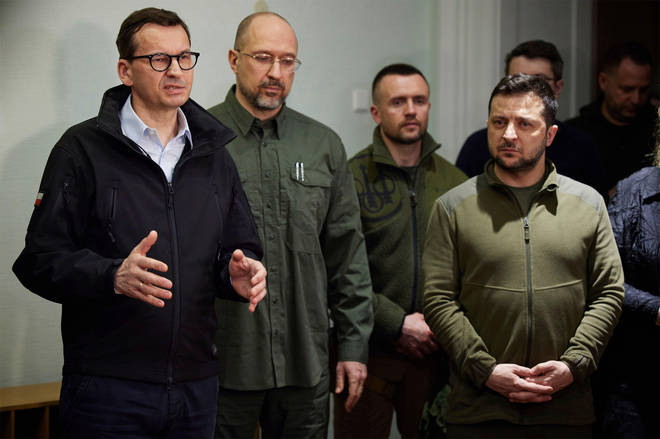 Polish Prime Minister Mateusz Morawiecki, left, remarks during a joint press conference following talks with Ukrainian President Volodymyr Zelenskyy, right