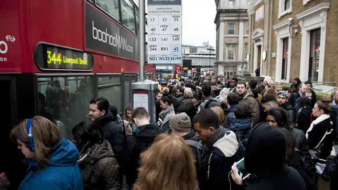 Crowds of commuters struggle to catch buses during a tube strike