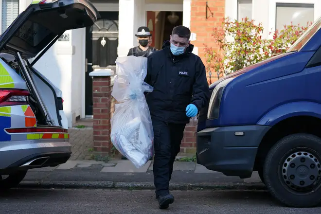 Items are removed from the property in Moore Street, Kingsley, Northampton following a discovery of a body in a rear garden.
