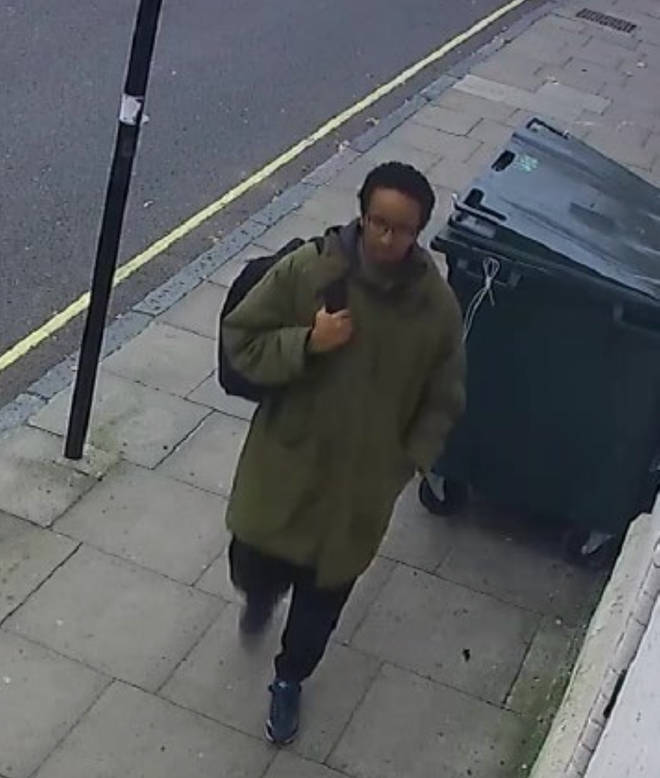 CCTV shows Ali wearing a long khaki coat and with a black backpack slung over his right shoulder